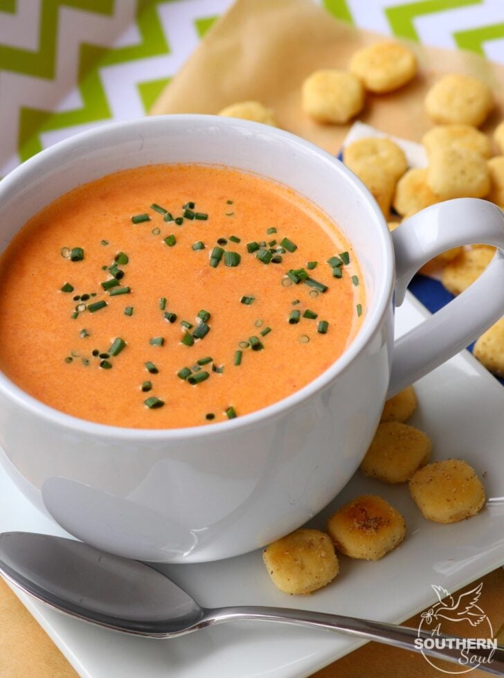 Tomatoes, onion and garlic, roasted to perfection then turned into a beautiful soup that's so easy to make.  One spoonful of this creamy, luscious soup and you'll be a fan for life!