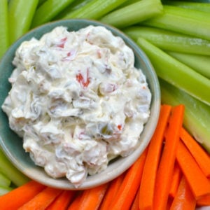 Cream cheese and olive spread with carrots and celert.