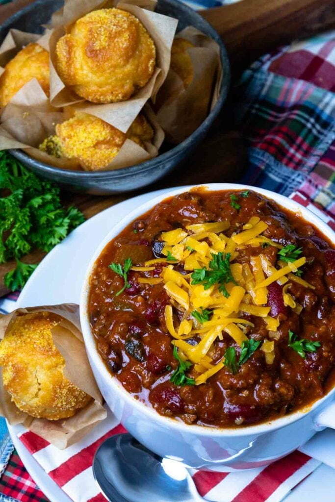 Award Winning Southern Soul Chili in a bowl with cheese and served with cornbread muffins is comfort food at it's best!