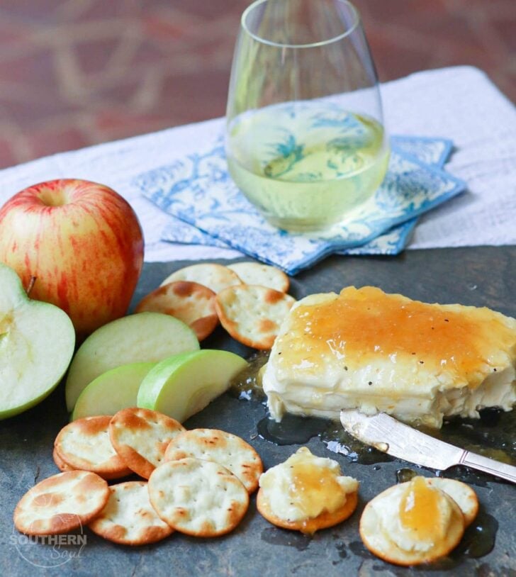 Jezebel Sauce made with pineapple preserves, apple jelly, horseradish, dry mustard and pepper is delicious as an appetizer or sauce for meat.