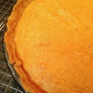 Sweet Potato Pie is a classic southern dessert that's irresistible! Make with simple ingredients and a prepared pie crust, this pie is perfect for a weeknight meal and is a MUST on your holiday table.