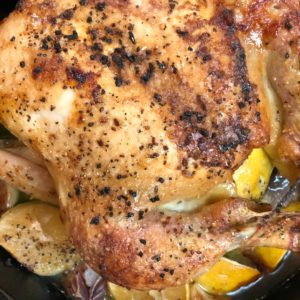 chicken roasted in cast iron with lemon onions and garlic