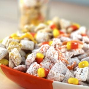 Candy corn Muddy Buddy snack mix is loaded with sweetness. It's a crunchy treat that everyone will love.