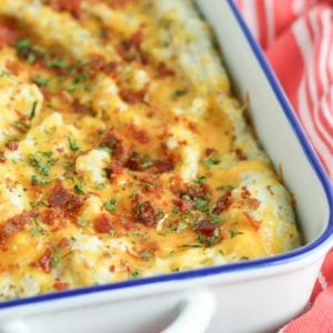 Twice baked potato casserole is a family favorite recipe. Loaded with bacon and cheese, it's a great side dish for the holidays or a week night meal.