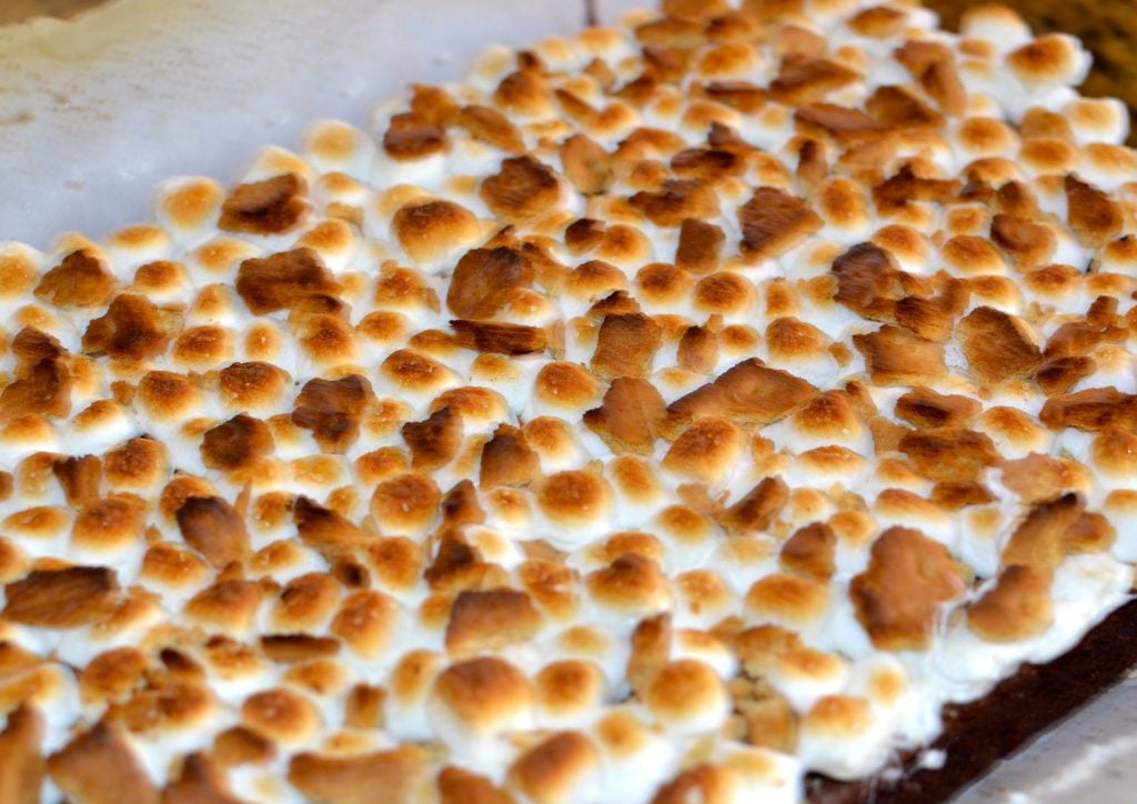 Smores brownies are easy to make since they start with a box cake mix. Just add marshmallow and graham cracker then broil until they're ooey and gooey!
