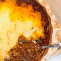 Beef Tips Shephard's Pie is the ulitmate dish for meat and potatoes lovers. Beef tips cooked low and slow then wrapped in buttery mashed potatoes will have everyone running to the supper table.
