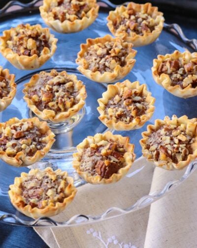Pecan Pie Tart Bites are a fun little treat loaded with all the flavor of a regular slice of pie! Easy to make with the help of store bought phyllo cups, this dessert comes together in less than 15 minutes.