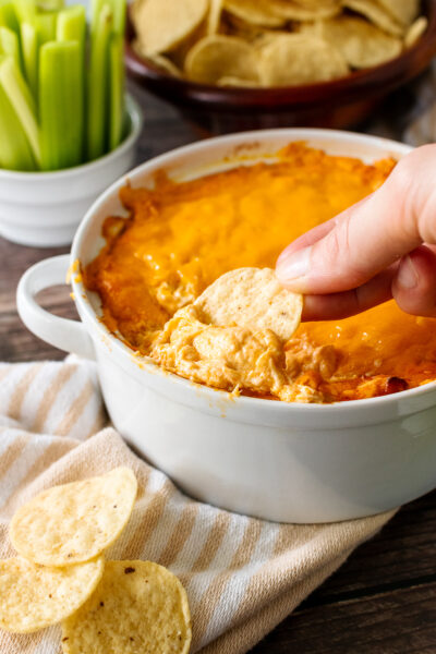 Buffalo chicken Dip with dipped tortilla chip.