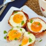 Ham and Cheese Egg Cups made in a muffin tin are a low carb breakfast that downright delicious. They are super easy to make with three ingredients are are ready to enjoy in less than 20 minutes.