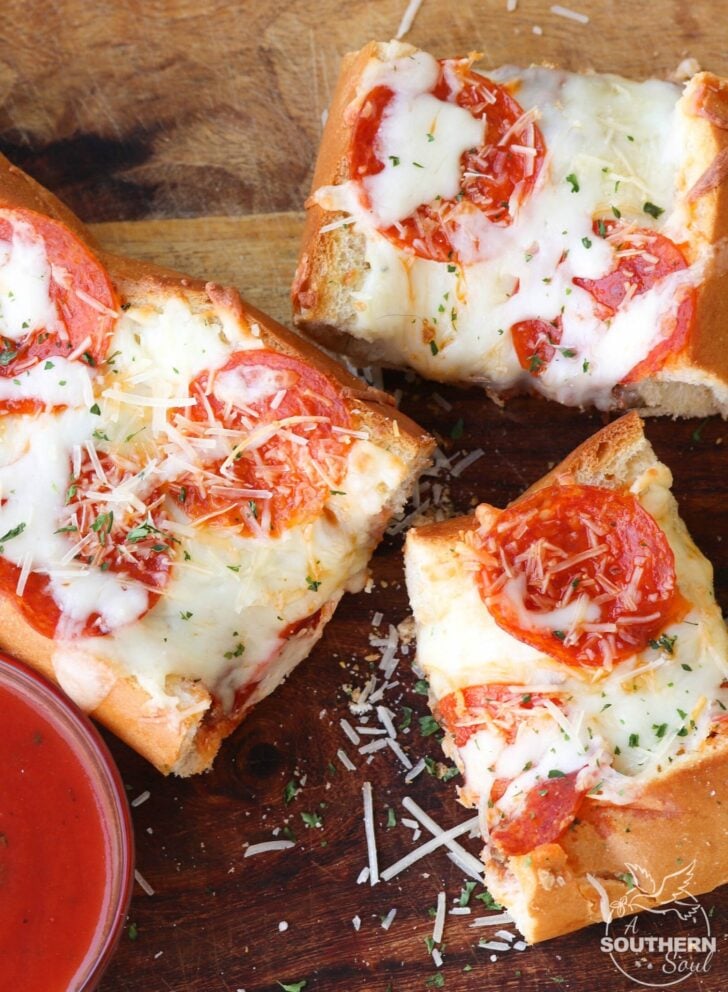 Meat Lovers Stuffed French Bread Pizza is easy to make and loaded with flavor. Hamburger and pepperoni along with two kinds of gooey cheese make this a recipe perfect for a weeknight meal or for game day!
