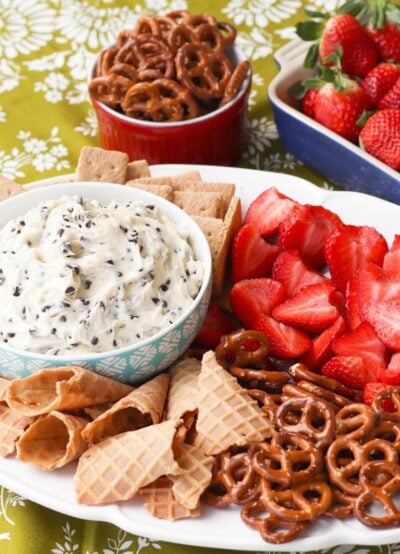 Chocolate Chips mixed with cream cheese, sugar and vanilla create a dip that tastes like a slice of bakery cheesecake! Serve with fresh fruit, pretzels, and cookies for a sweet treat everyone will love.