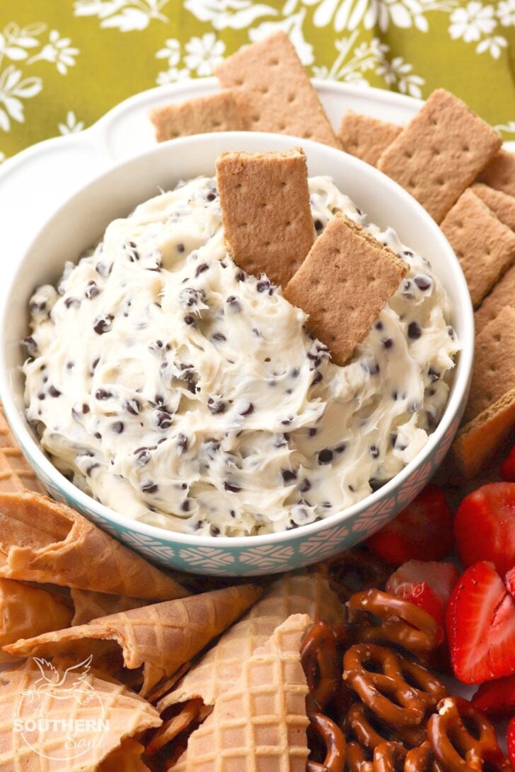 Chocolate Chips mixed with cream cheese, sugar and vanilla create a dip that tastes like a slice of bakery cheesecake! Serve with fresh fruit, pretzels, and cookies for a sweet treat everyone will love.