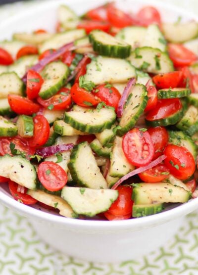 Tomato cucumber red onion salad in a light citrus dressing.