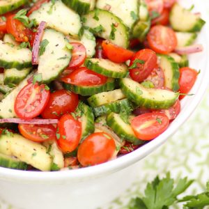 Tomato Cucumber Salad made with fresh vegetables is a simple salad with a healthy dressing of olive oil, balsamic vinegar, lemon juice and herbs.