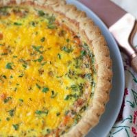 Easy to make Three Cheese Quiche made with cheddar, mozzerella and Parmesan is a great main dish for breakfast, brunch or a weeknight meal.