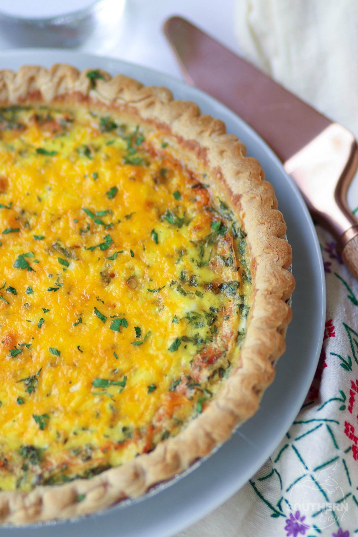 Easy to make Three Cheese Quiche made with cheddar, mozzerella and Parmesan is a great main dish for breakfast, brunch or a weeknight meal.