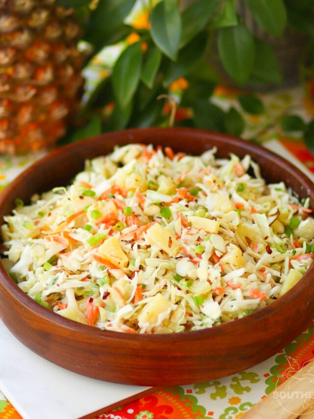 Pineapple Slaw is made with pineapple chunks, bagged cabbage, sliced almonds and green onions with a light, sweet dressing is a side dish that is great for any occasion!
