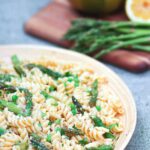 Tender pasta, with fresh sauteed asparagus and sweet peas tossed in a bright lemony dressing is a salad that's easy to make and full of flavor!