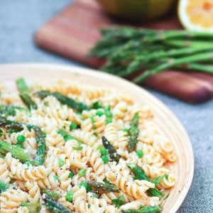 Tender pasta, with fresh sauteed asparagus and sweet peas tossed in a bright lemony dressing is a salad that's easy to make and full of flavor!