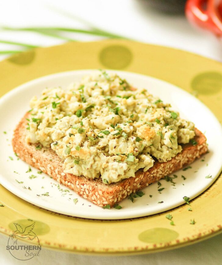 Creamy, light egg salad taken to a whole new level with avocado. Add in fresh chives and lemon juice for a new twist on a classic recipe!