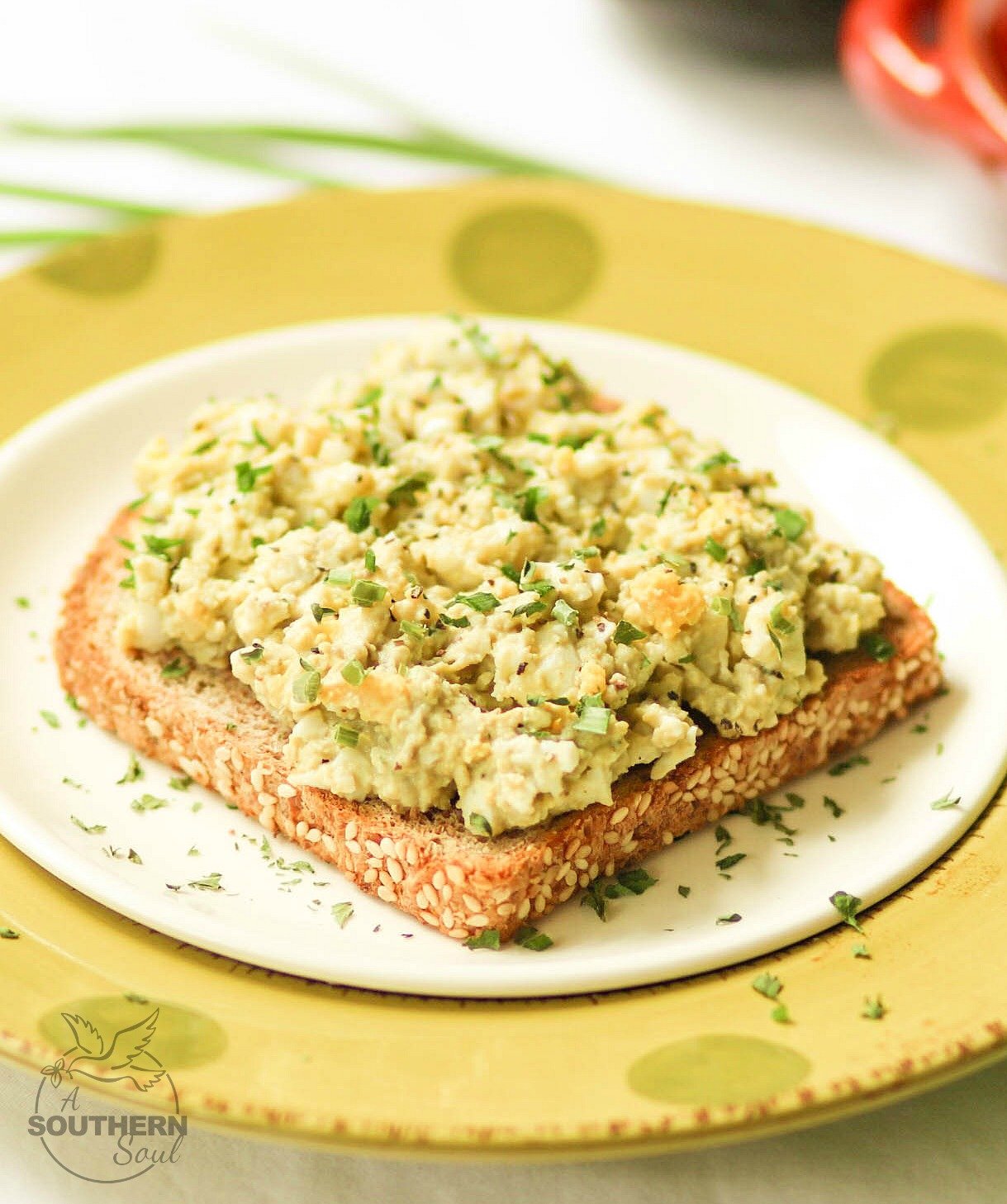Creamy, light egg salad taken to a whole new level with avocado. Add in fresh chives and lemon juice for a new twist on a classic recipe!