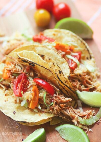 Shredded chicken cooked low and slow in the crock pot is flavored with taco seasoning and salsa. It's an easy to make recipe that great for tacos, nachos, burrito bowls and salads.