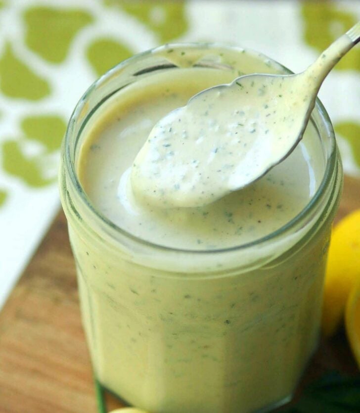 Green Goddess Dressing made with chives, parsley, garlic mayonnaise, sour cream and a few other ingredients is a classic recipe for salads, fish and pasta.