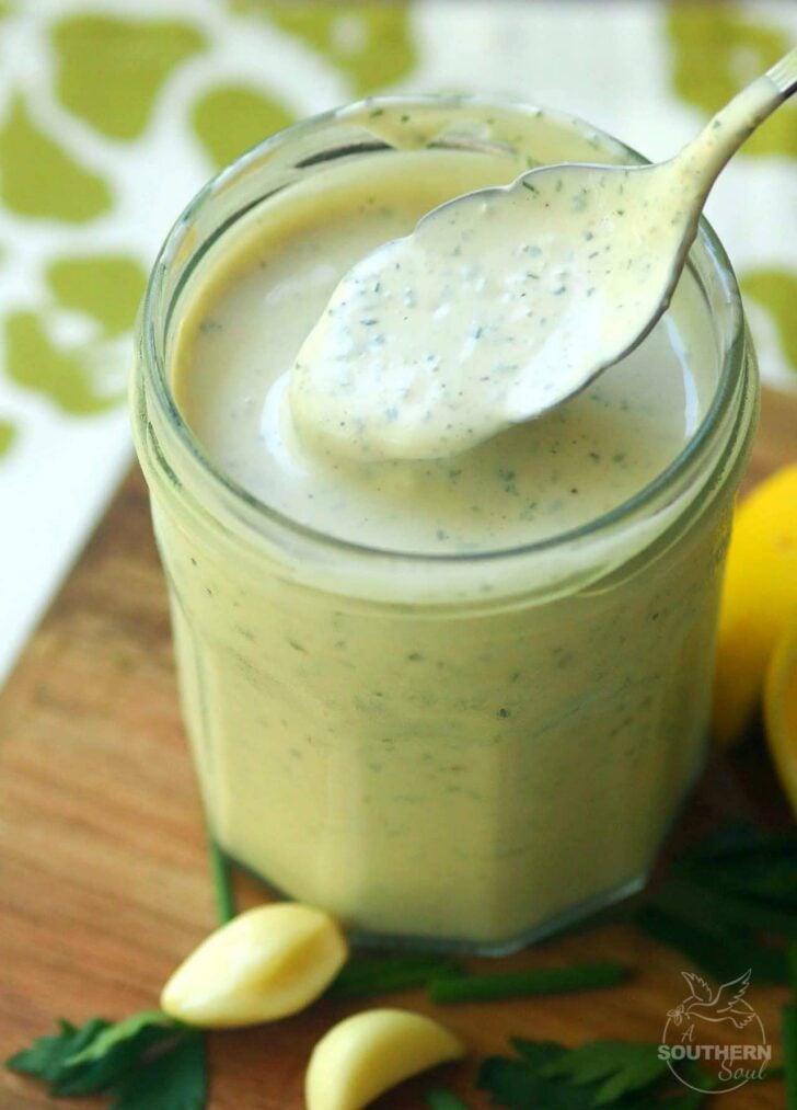 Green Goddess Dressing made with chives, parsley, garlic mayonnaise, sour cream and a few other ingredients is a classic recipe for salads, fish and pasta.