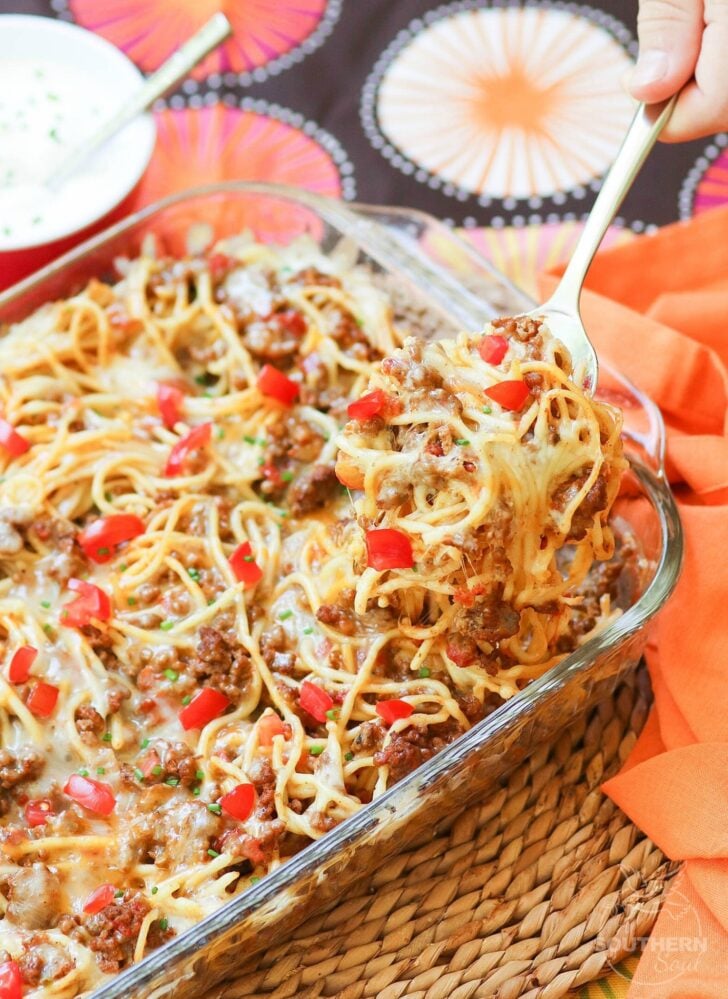 Taco Spaghetti Bake is an easy to make casserole made with ground beef, taco seasoning, pasta and cheese that's a family favorite dish!