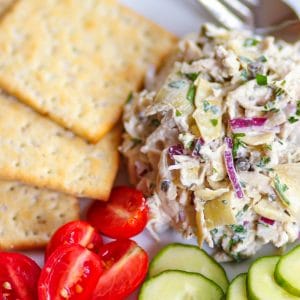 Artichoke Chicken Salad made with shredded white meat chicken, artichokes, capers and red onion tossed in a creamy, light, fresh dressing is a great new twist on a classic recipe!