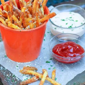 Store bought shoe string potatoes are fried to perfection with very little oil in the air fryer. They are tossed in garlic butter then sprinkled with salt, Parmesan cheese and parsley for a treat that is crazy good!
