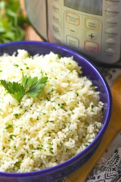 Rice made in the Instant Pot with garlic, fresh parsley and chives, along with butter is an easy to make side dish that turns out perfectly every time!