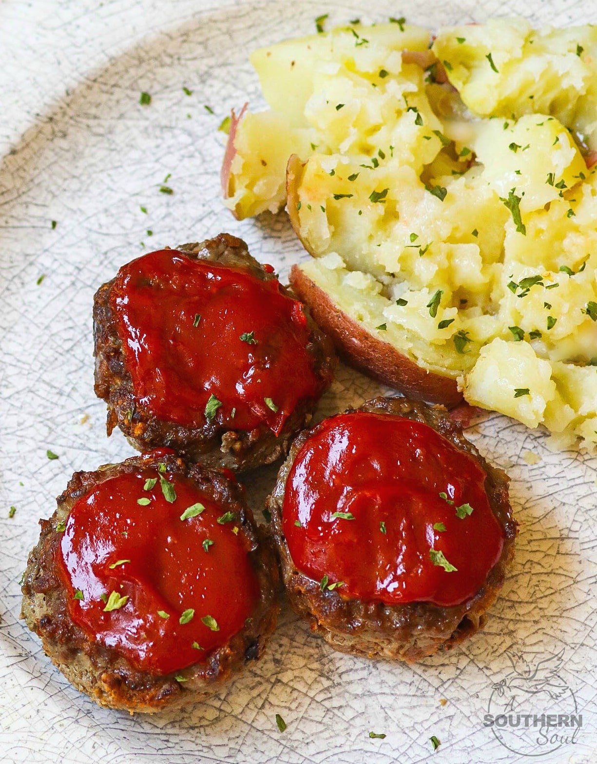 Meatloaf Muffins made with ground beef, eggs, bread crumbs, Parmesan Cheese and seasoned to perfect are easy to make and perfect for a weeknight meal!