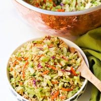 Ramen Broccoli Slaw made with toasted, packaged noodles, broccoli, carrots, green onion and a savory sweet dressing is a delicious side dish. Perfect for a weeknight meal, cookout, pot luck or covered dish supper.