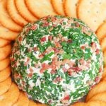 Jalapeno Popper Cheese Ball made with cream cheese, jalapenos, cheddar cheese, ranch seasoning, bacon and chives is an easy to make crowd please appetizer!