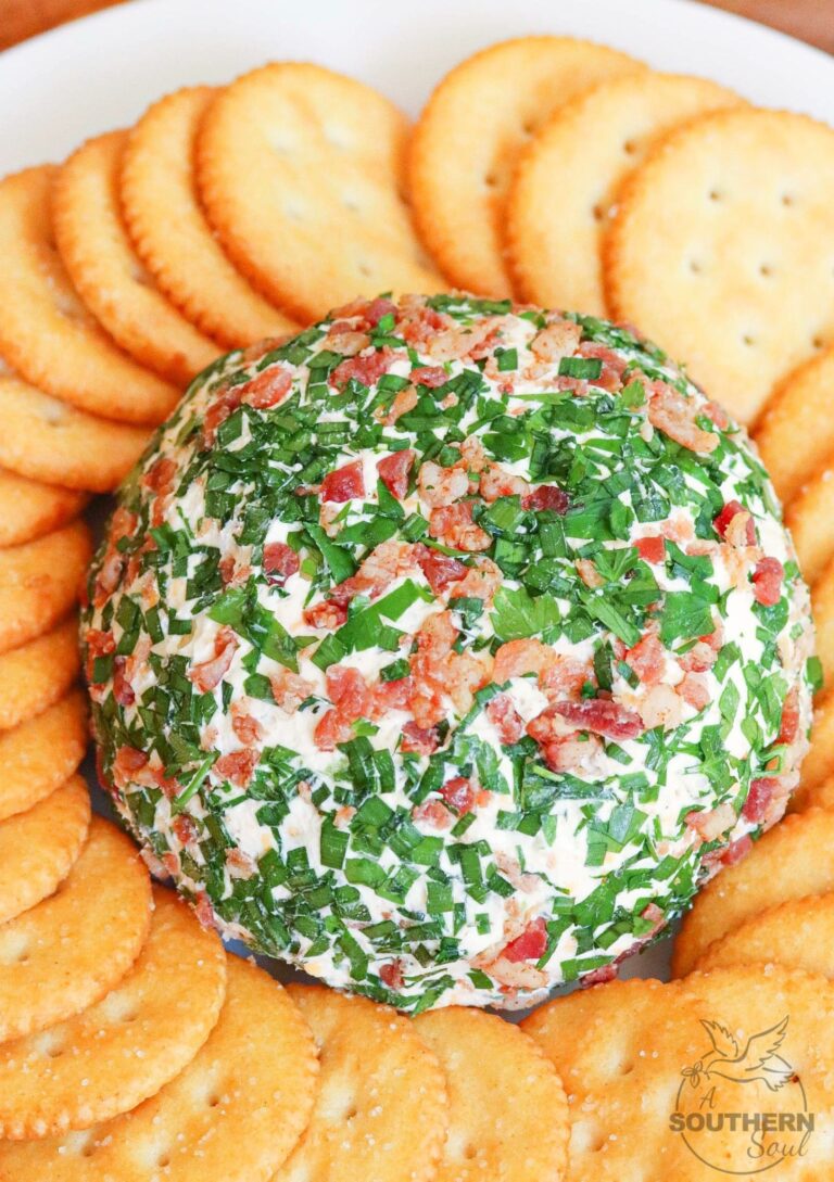 Jalapeno Popper Cheese Ball made with cream cheese, jalapenos, cheddar cheese, ranch seasoning, bacon and chives is an easy to make crowd please appetizer!