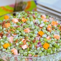 Classic Pea Salad made with thawed peas, cheese, bacon and red onion, then tossed in a creamy, sweet & tangy dressing is a classic side dish that perfect to serve any time of the year!