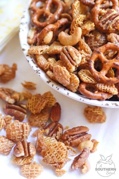 Sweet and Nutty Snack Mix made with brown sugar, butter and corn syrup, them baked until golden brown is a snack that's totally irresistible!