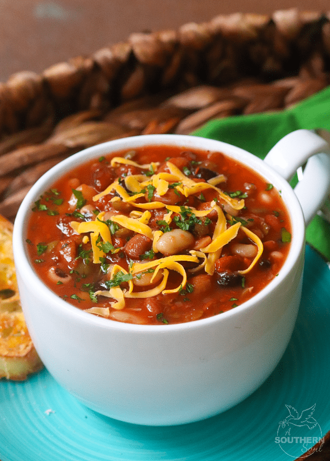 15 Bean Soup made with protein packed bean cooked in vegetable stock with crushed tomatoes, onions, garlic and seasonings is a bowl full of comfort!