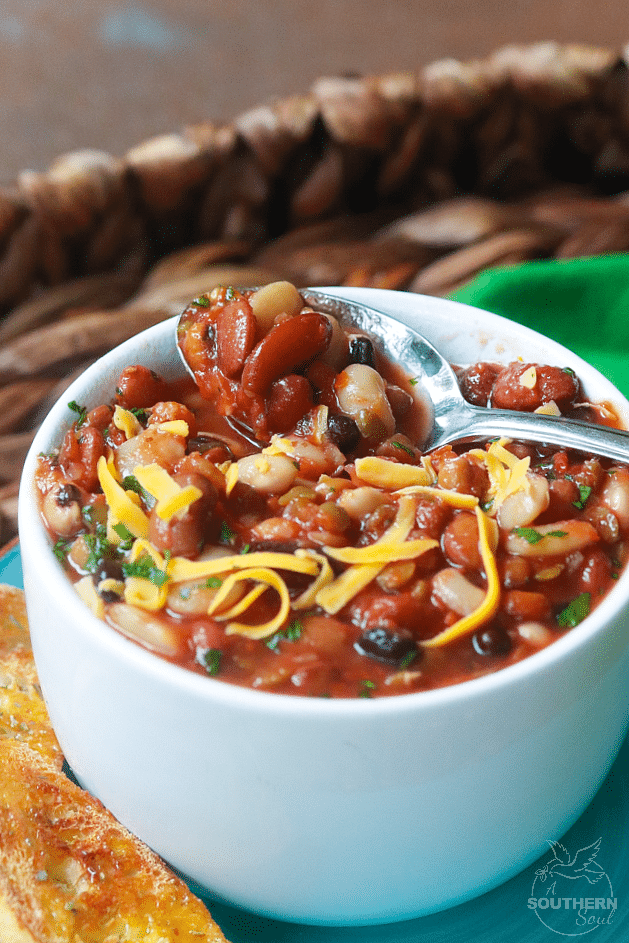 15 Bean Soup made with protein packed bean cooked in vegetable stock with crushed tomatoes, onions, garlic and seasonings is a bowl full of comfort!