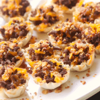 Bacon Cheeseburger Bites made with ground beef, bacon and cheese stuffed phyllo cups are great for parties, tailgating and the perfect bite size snack!
