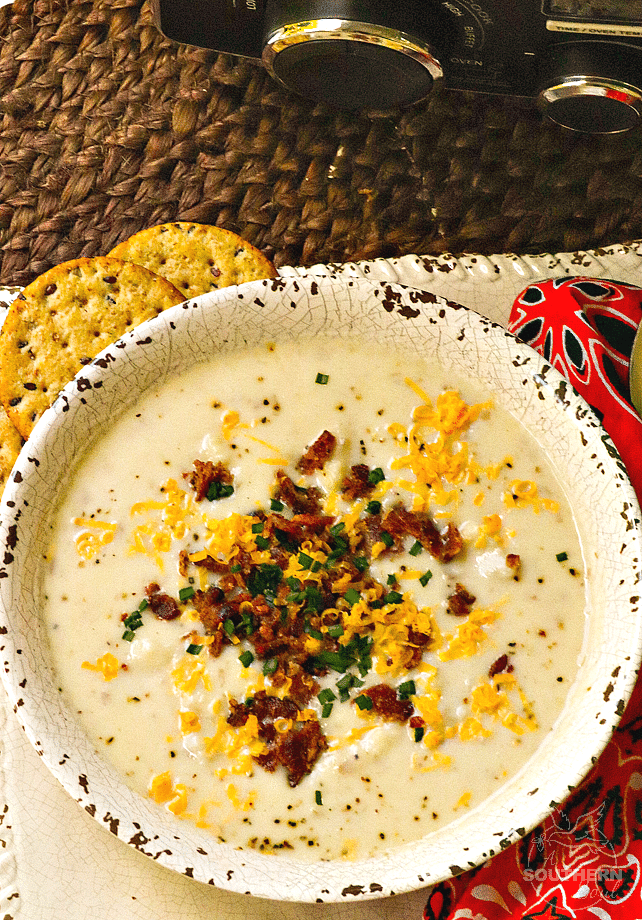 Rich, creamy potato soup made in the crockpot is topped it with cheese, bacon and chives just like a loaded baked potato.
