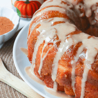Pumpkin Spice Monkey Bread made with biscuits, spices, cream cheese and pumpkin is a fall treat that's over the top delicious! This easy to make bread is great as a dessert, snack or served for brunch.