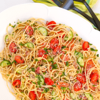 Spaghetti Salad is the perfect side dish for a party, potluck or when you're feeding a crowd. Made with tender pasta, pepperoni, fresh veggies and tossed in a zesty dressing then topped with Parmesan cheese, this easy to make salad is ideal for "soup and salad" night!