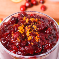 Easy to make Orange Cranberry Sauce a must make for the holidays. Sweetened with honey and maple syrup then flavored with fresh orange juice, zest and cinnamon, this no-sugar recipe is over the top delicious!