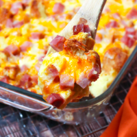 Ham and Cheese Strata made with eggs, bread, cheddar and mozzarella cheese plus cubed ham is a delicious breakfast casserole. An overnight dish that's great for brunch or a simple dinner.