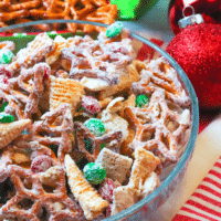 Christmas Snack Mix is a festive blend of rice cereal, pretzels, corn snacks and M&M all coated is a sweet vanilla bark. This easy to make treat is sure to make Christmas extra sweet.
