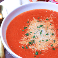 Roasted Garlic Tomato Soup made with tomatoes, onion, roasted garlic, cream and vegetable stock is so easy to make you'll never go back to the canned stuff again.