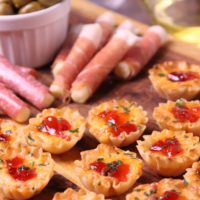 Crispy Phyllo cups filled with pimento cheese then topped with sweet, slightly spicy red pepper jelly makes for delicious appetizer for the holidays, game day or whenever you're entertaining!