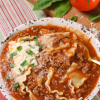 One Pot Lasagna Soup is full of flavor that you love from this classic Italian dish. Made with ground beef, onions, crushed tomatoes, vegetable stock, herbs, lasagna noodles and topped with creamy ricotta and Parmesan.